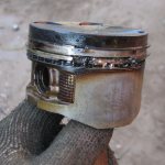 checking the piston for wear
